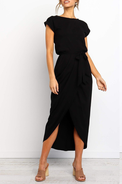 Black - Woman wearing a solid short sleeve midi dress with a tie waist and front slit hem
