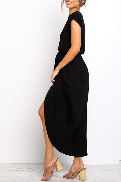 Black - Woman wearing a solid short sleeve midi dress with a tie waist and front slit hem
