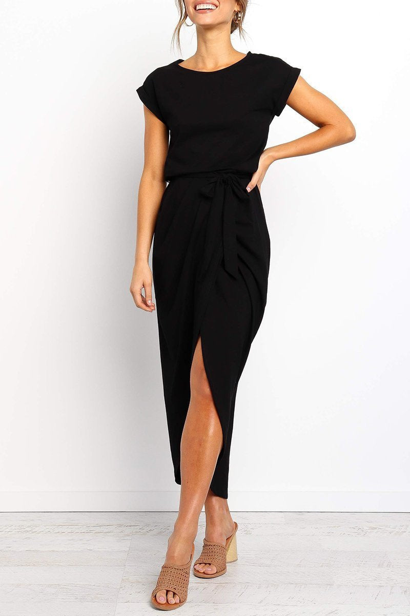 Black - Woman wearing a solid short sleeve midi dress with a tie waist and front slit hem