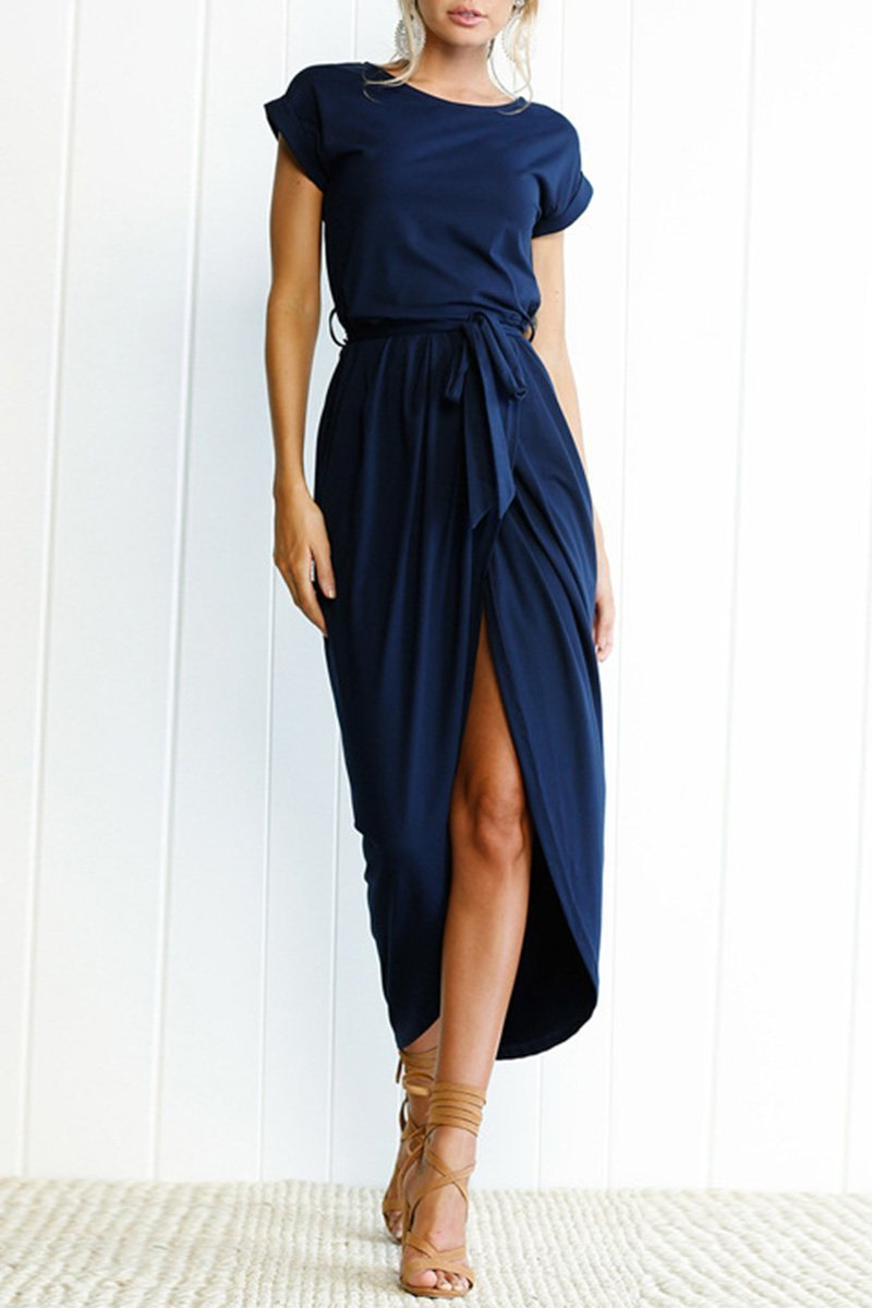 Navy - Woman wearing a solid short sleeve midi dress with a tie waist and front slit hem