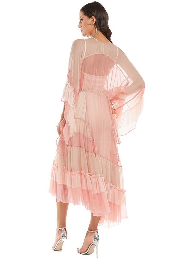Woman in light pink chiffon tiered ruffle midi dress