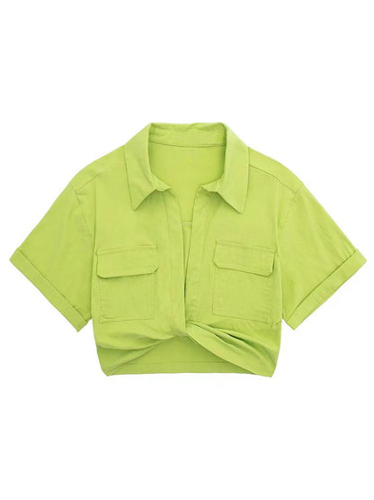 Woman wearing lime green cotton crop top with twisted front