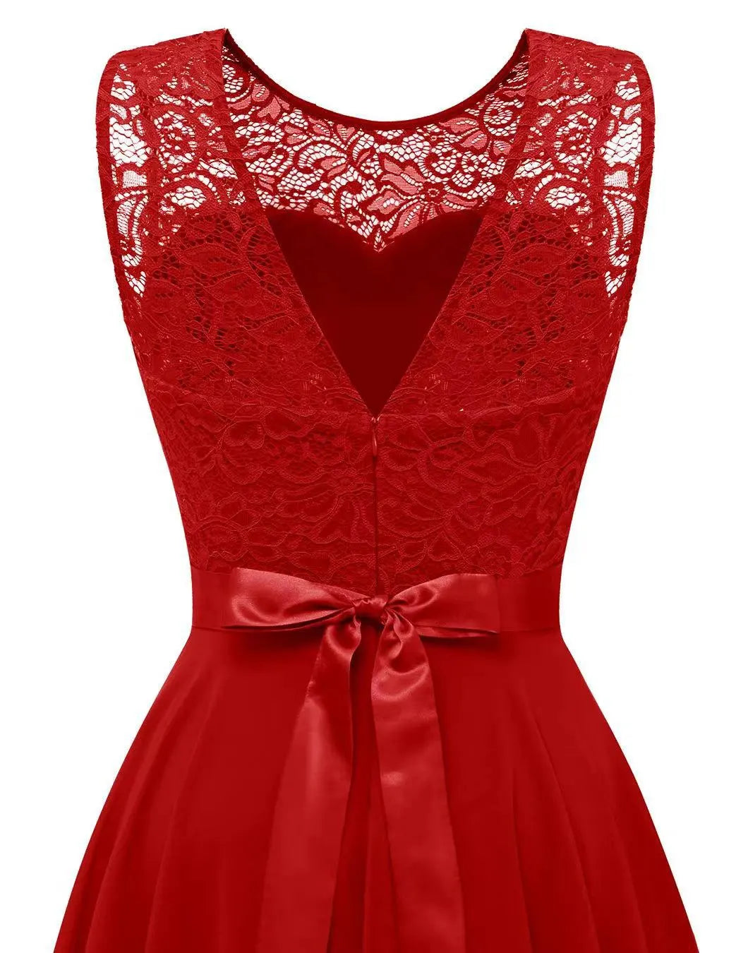 Gold - A woman wearing a sleeveless burgundy high-low dress with a textured lace bodice and a flowing chiffon skirt, paired with silver strappy heels.