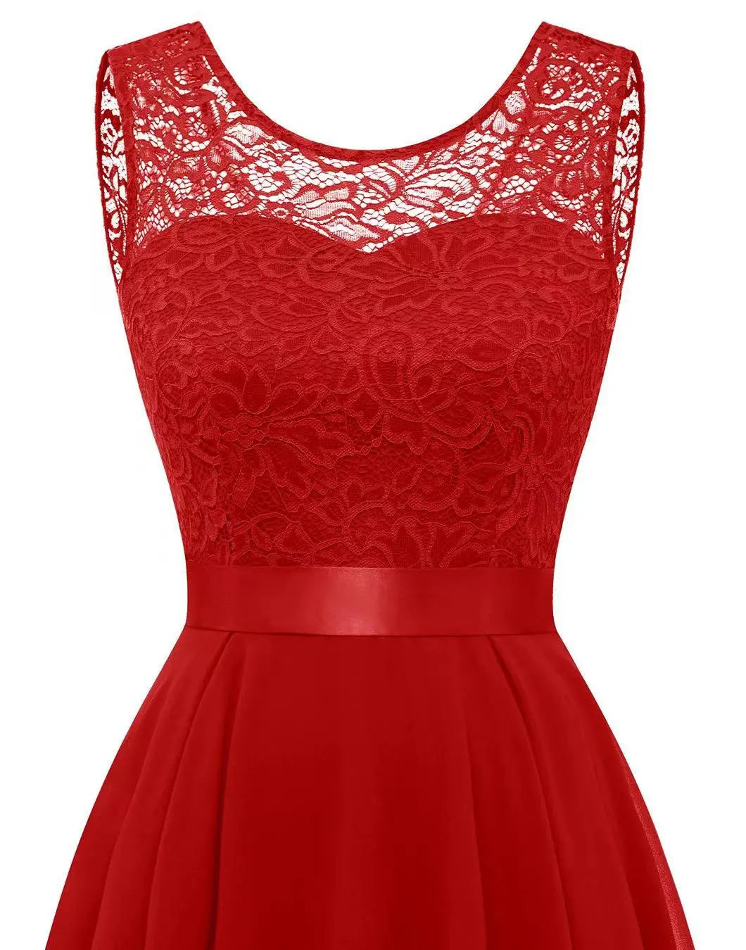 Gold - A woman wearing a sleeveless burgundy high-low dress with a textured lace bodice and a flowing chiffon skirt, paired with silver strappy heels.