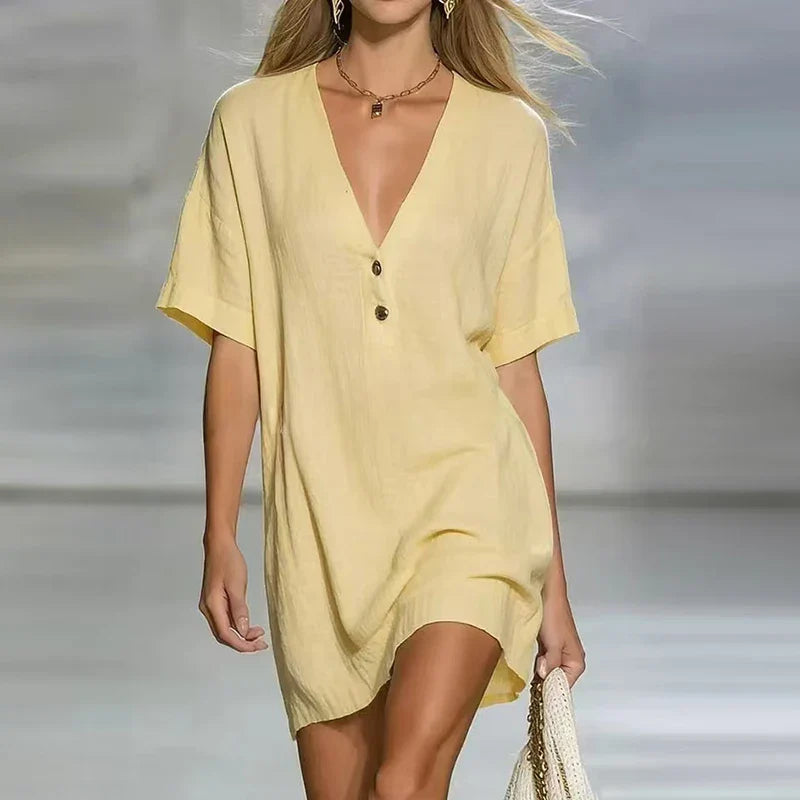 Lemon Yellow - Woman wearing a textured linen short sleeve mini dress with a relaxed fit and partial button front detail