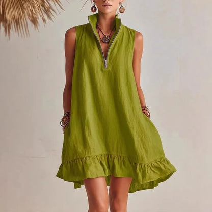 Green - Women's sleeveless A-line mini dress in a textured fabric featuring a high neck with a half-zip closure, side pockets, and a ruffle hem