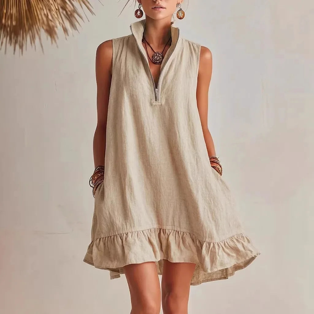 Khaki - Women's sleeveless A-line mini dress in a textured fabric featuring a high neck with a half-zip closure, side pockets, and a ruffle hem