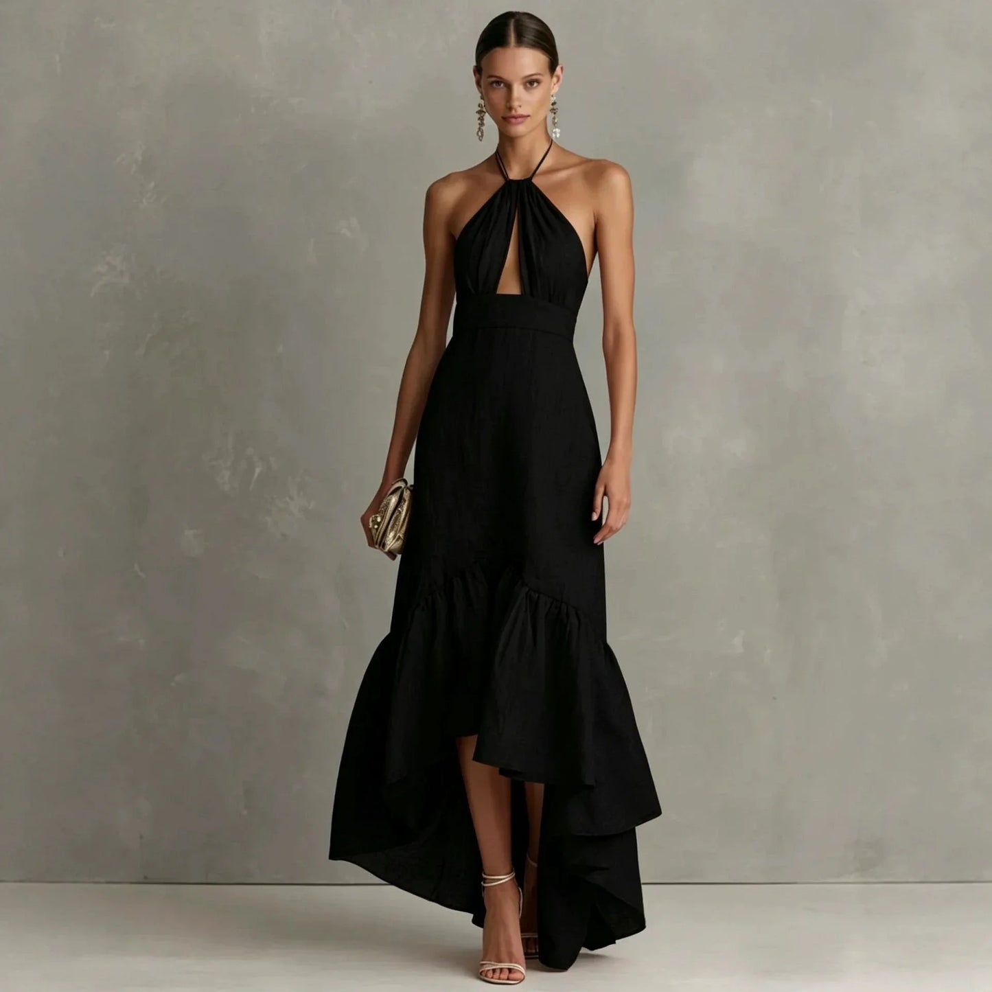 Black - A woman wearing a black linen-blend halter neck maxi dress with a front keyhole cutout, a fitted waist, and a dramatic ruffled high-low hemline.