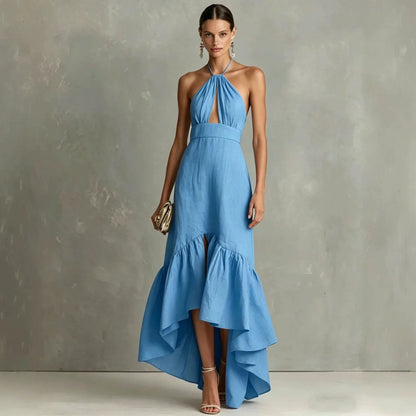 Sky Blue - A woman wearing a black linen-blend halter neck maxi dress with a front keyhole cutout, a fitted waist, and a dramatic ruffled high-low hemline.