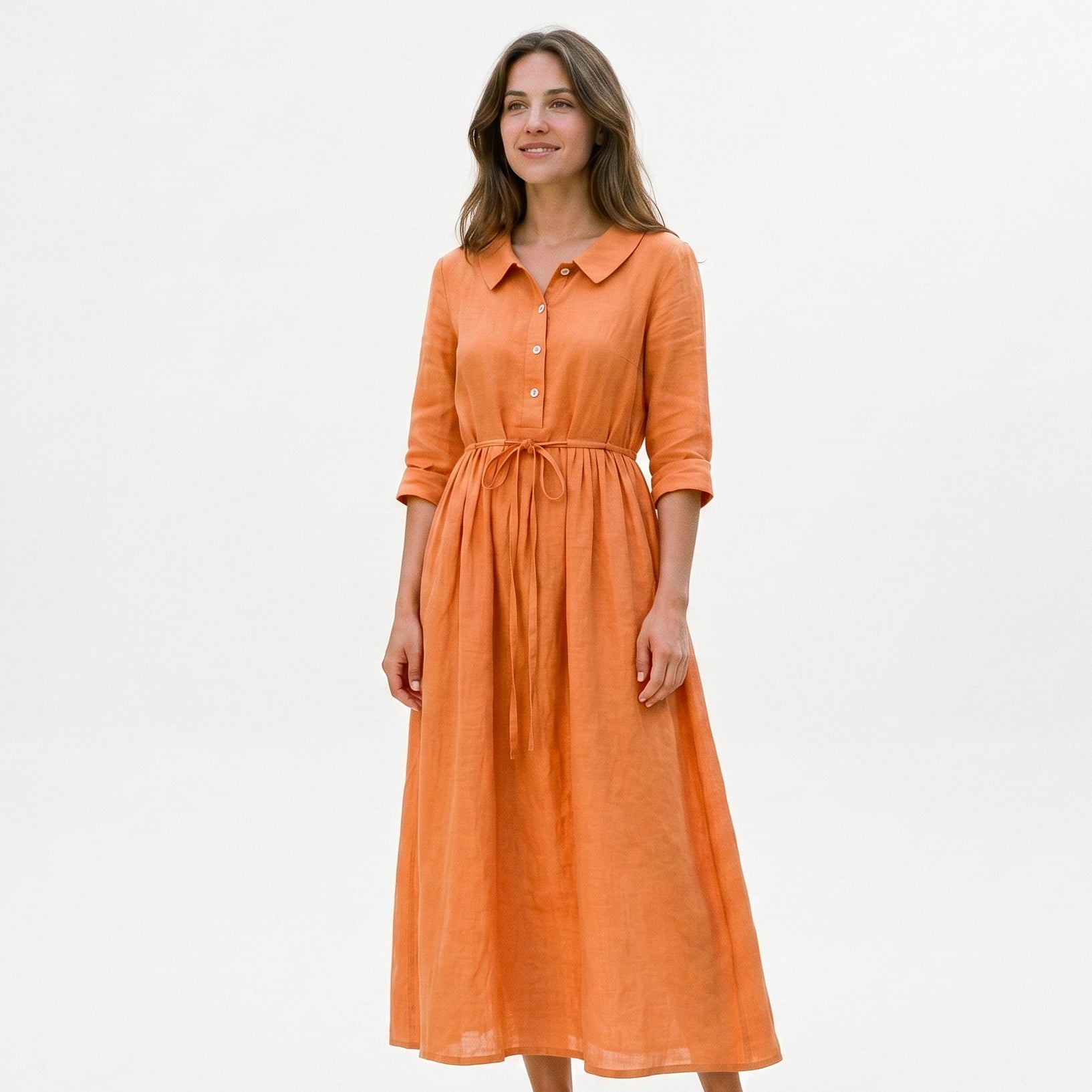 Orange - Model wearing a relaxed collared midi shirtdress with a front button placket, three-quarter sleeves, and an adjustable waist tie.