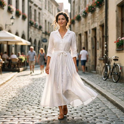 Light Brown - Model wearing a relaxed collared midi shirtdress with a front button placket, three-quarter sleeves, and an adjustable waist tie.