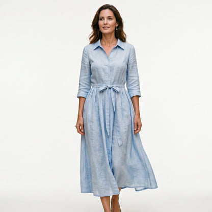 Sky Blue - Model wearing a relaxed collared midi shirtdress with a front button placket, three-quarter sleeves, and an adjustable waist tie.