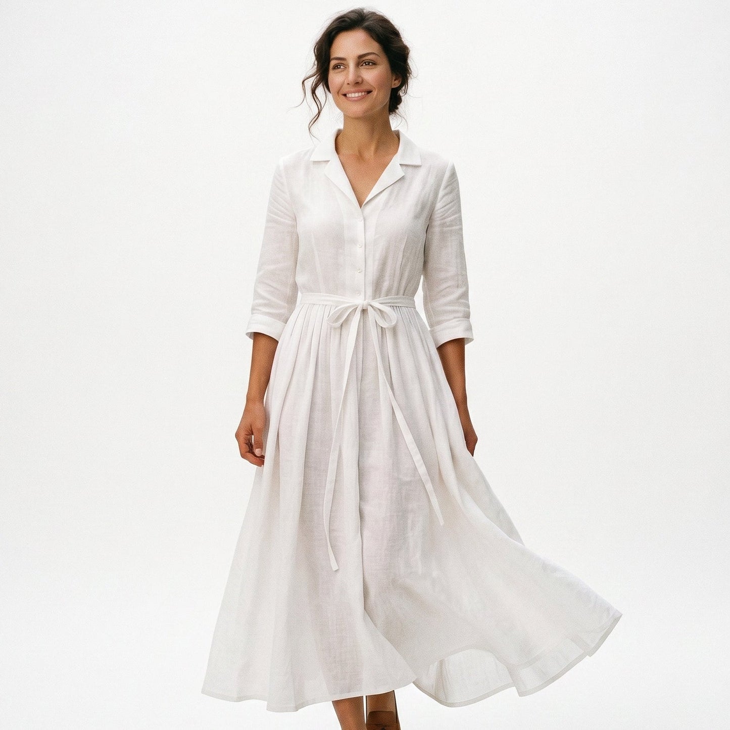 White - Model wearing a relaxed collared midi shirtdress with a front button placket, three-quarter sleeves, and an adjustable waist tie.