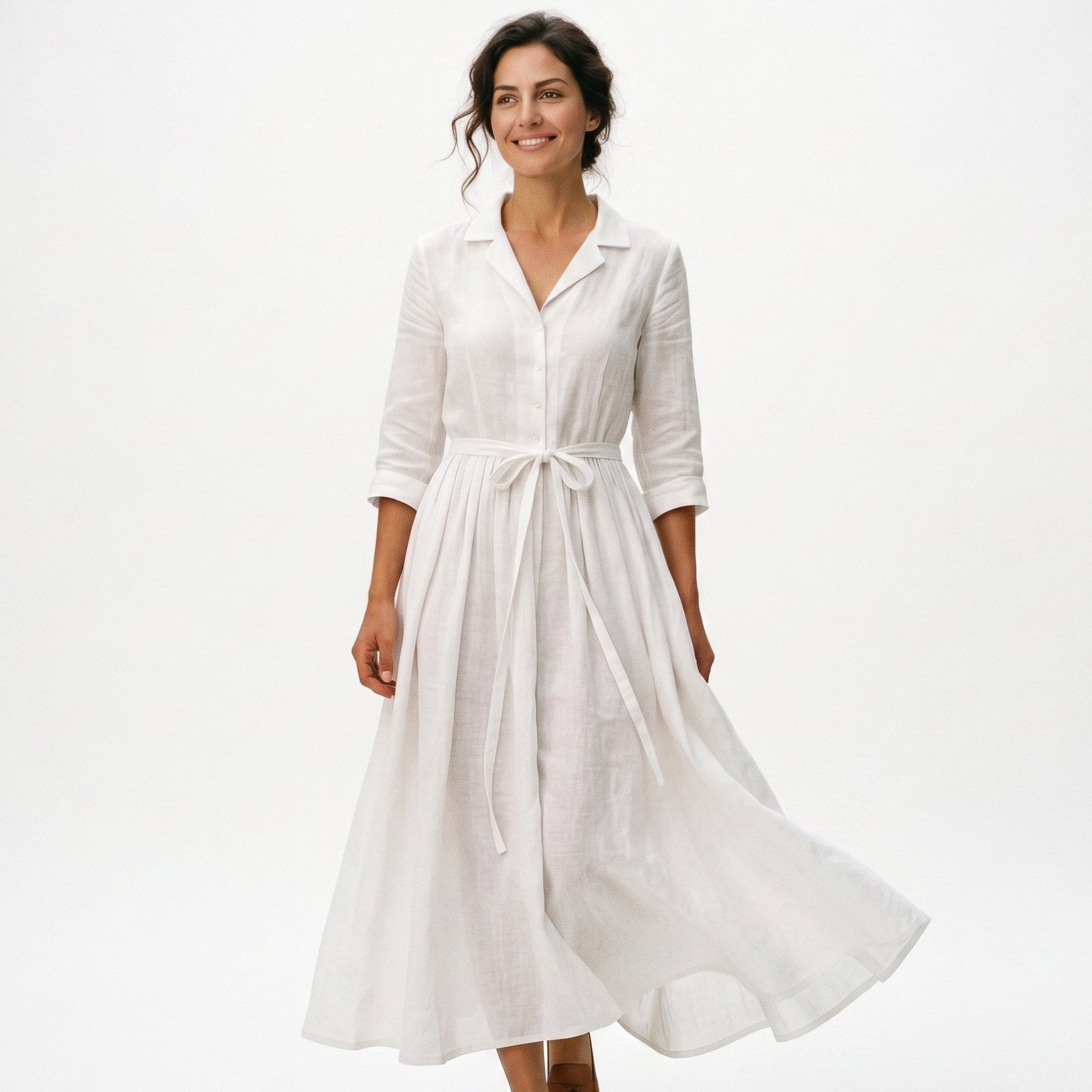White - Model wearing a relaxed collared midi shirtdress with a front button placket, three-quarter sleeves, and an adjustable waist tie.