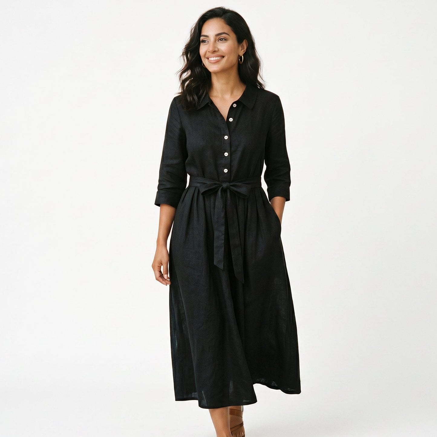 Black - Model wearing a relaxed collared midi shirtdress with a front button placket, three-quarter sleeves, and an adjustable waist tie.