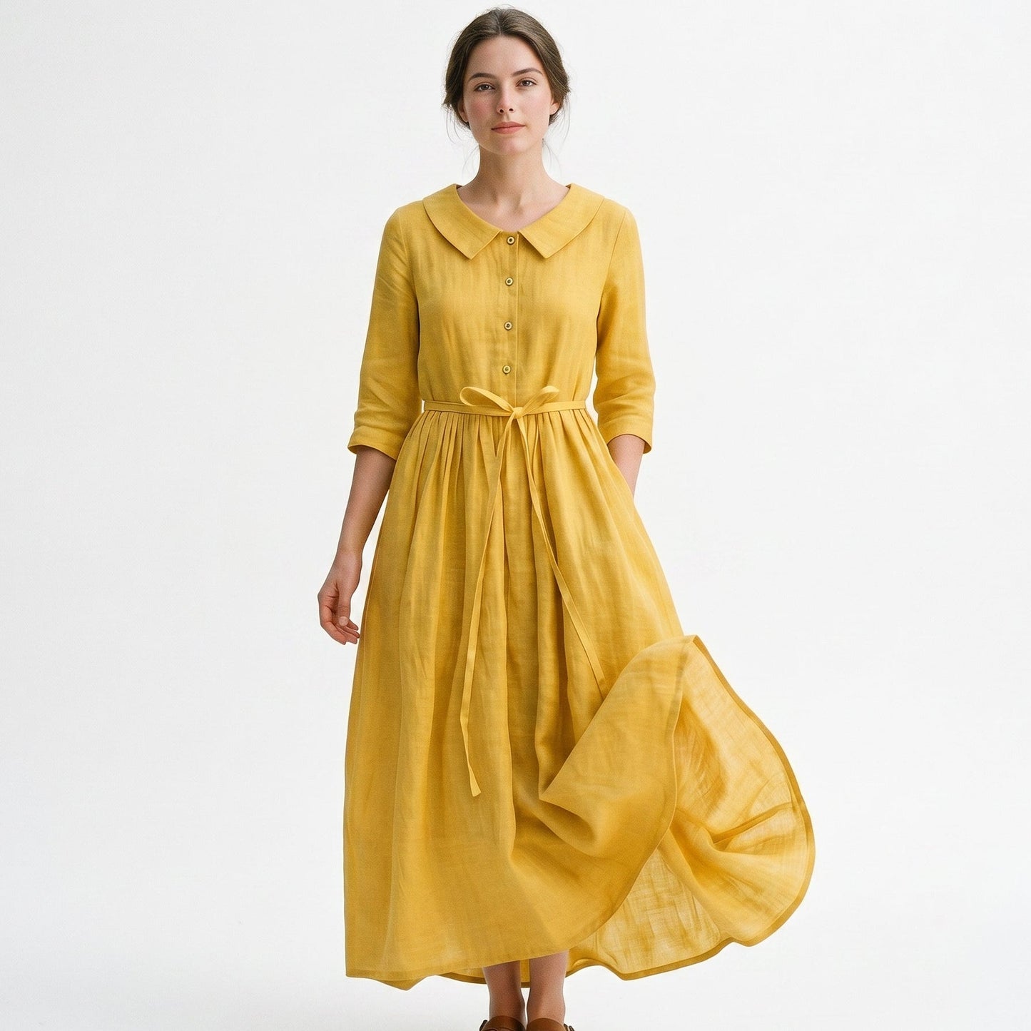Yellow - Model wearing a relaxed collared midi shirtdress with a front button placket, three-quarter sleeves, and an adjustable waist tie.