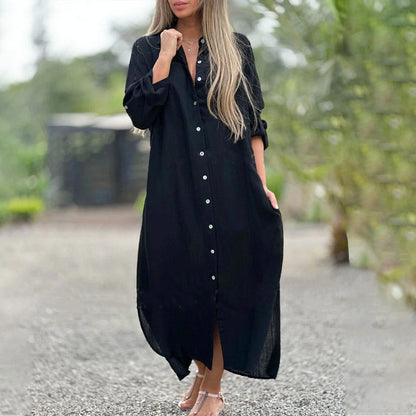 Black - A woman wearing a relaxed-fit, white linen-blend maxi shirt dress with long sleeves rolled up, featuring a button-down front, classic collar, and side pockets, standing outdoors.