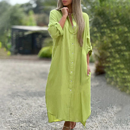 Green - A woman wearing a relaxed-fit, white linen-blend maxi shirt dress with long sleeves rolled up, featuring a button-down front, classic collar, and side pockets, standing outdoors.