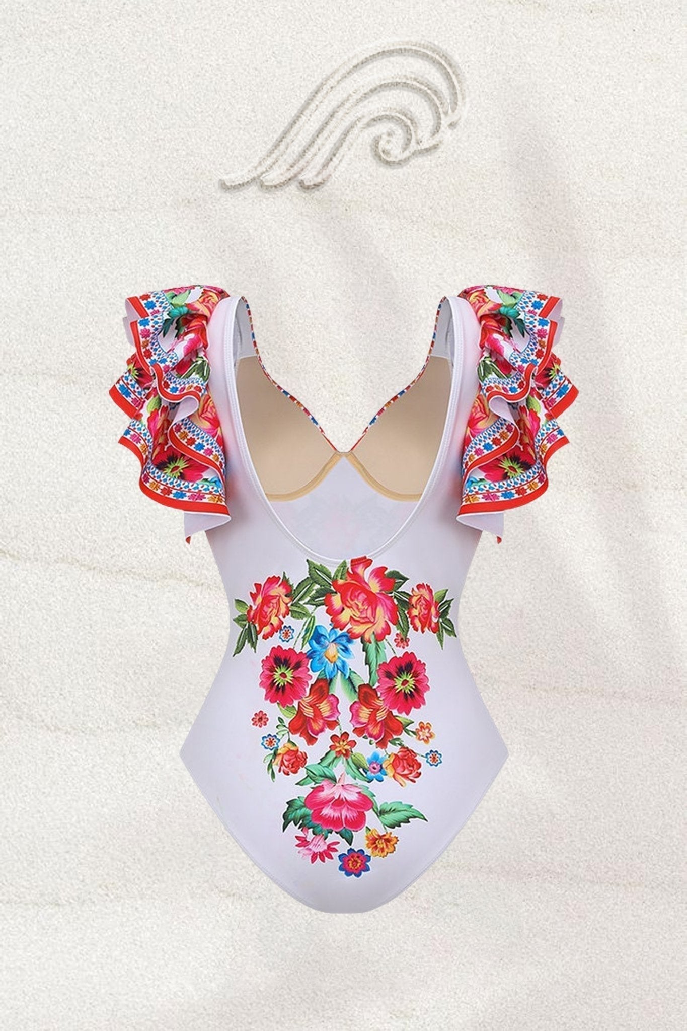Woman in white floral print swimsuit with ruffled sleeves