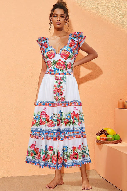 Woman in white floral print swimsuit with ruffled sleeves
