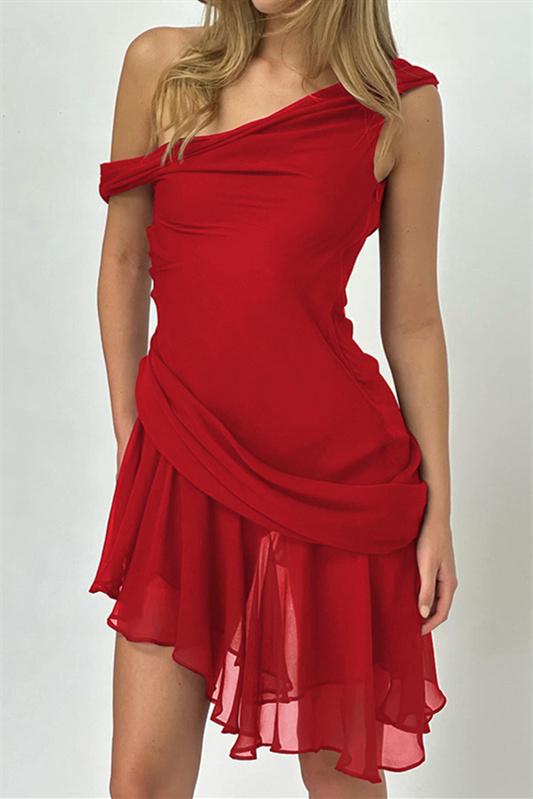 Woman in red chiffon mini dress crouching
