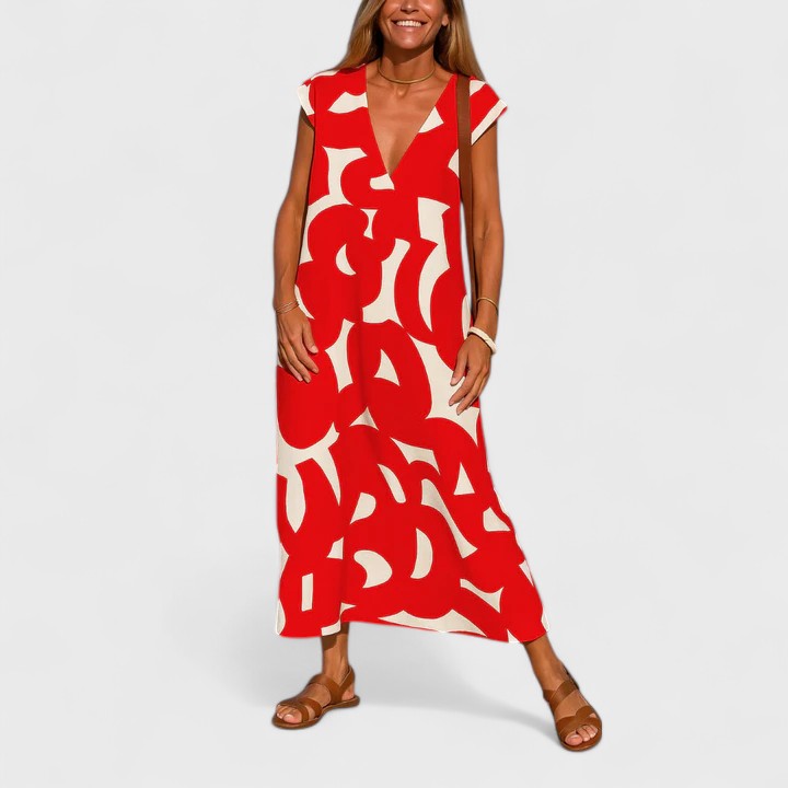 Red - A woman wearing a black and white abstract graphic print midi dress with a V-neckline, cap sleeves, and a relaxed shift silhouette, styled with brown leather sandals and a shoulder bag.
