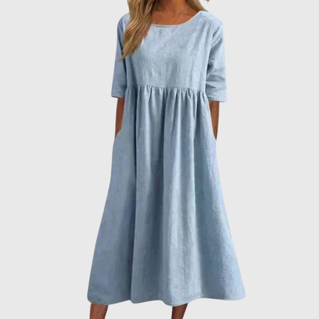 Light Blue - A woman wearing a solid white linen-blend midi dress with a scoop neckline, elbow-length half sleeves, a gathered empire waist, and a flowy skirt with side pockets.
