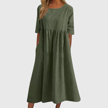 Army Green - A woman wearing a solid white linen-blend midi dress with a scoop neckline, elbow-length half sleeves, a gathered empire waist, and a flowy skirt with side pockets.
