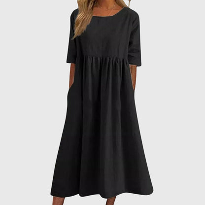 Black - A woman wearing a solid white linen-blend midi dress with a scoop neckline, elbow-length half sleeves, a gathered empire waist, and a flowy skirt with side pockets.