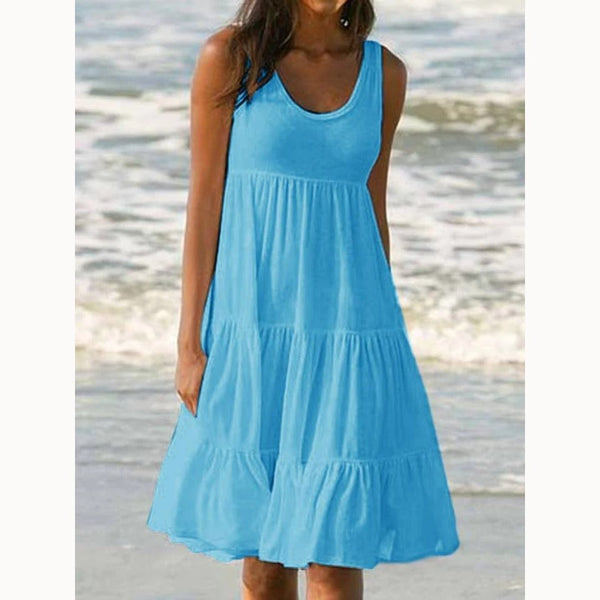 Rose Red - A woman wearing a sleeveless white cotton jersey tiered midi sundress with a scoop neckline and relaxed A-line silhouette.