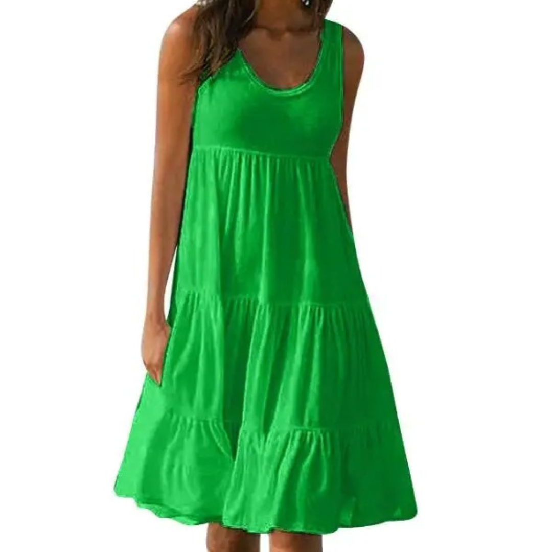 Green - A woman wearing a sleeveless white cotton jersey tiered midi sundress with a scoop neckline and relaxed A-line silhouette.