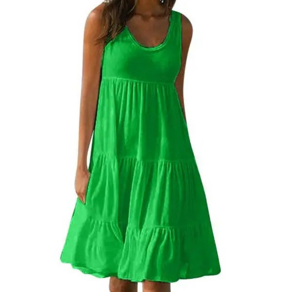 Green - A woman wearing a sleeveless white cotton jersey tiered midi sundress with a scoop neckline and relaxed A-line silhouette.