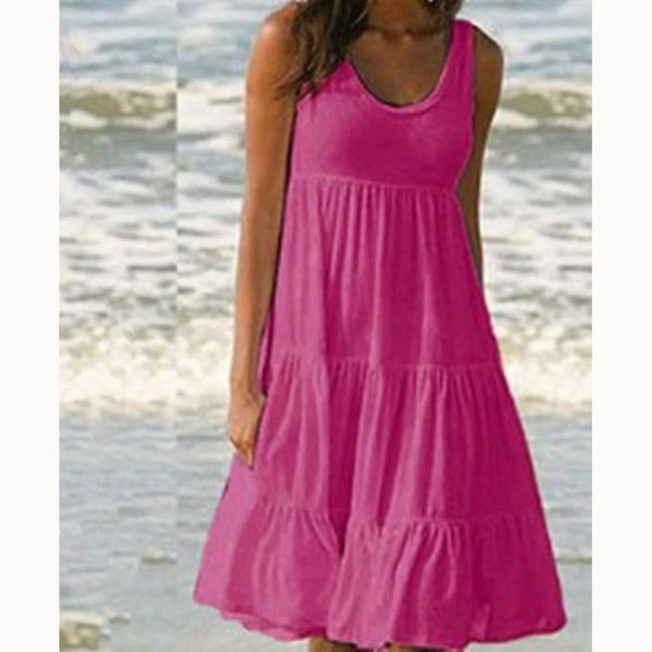 Rose Red - A woman wearing a sleeveless white cotton jersey tiered midi sundress with a scoop neckline and relaxed A-line silhouette.