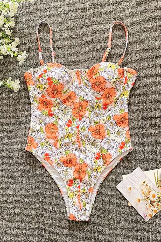 Woman in peach and white plaid one-piece swimsuit