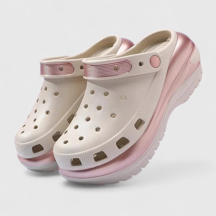 Khaki - Molded foam slip-on platform clogs featuring ventilation ports across the upper, a pivoting heel strap, and a distinct metallic trim along the thick midsole