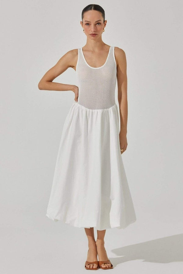 Woman in white crochet knit bodice dress