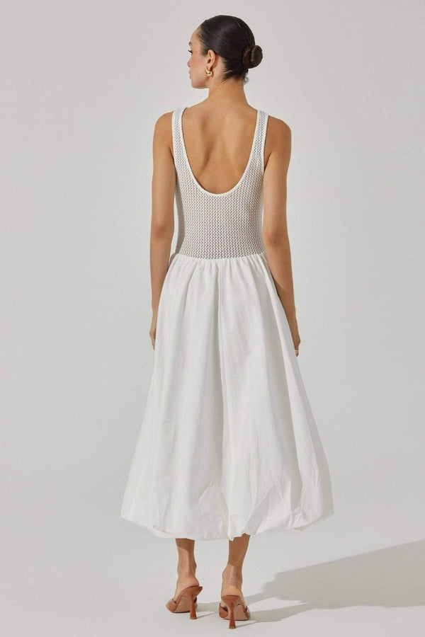 Woman in white crochet knit bodice dress