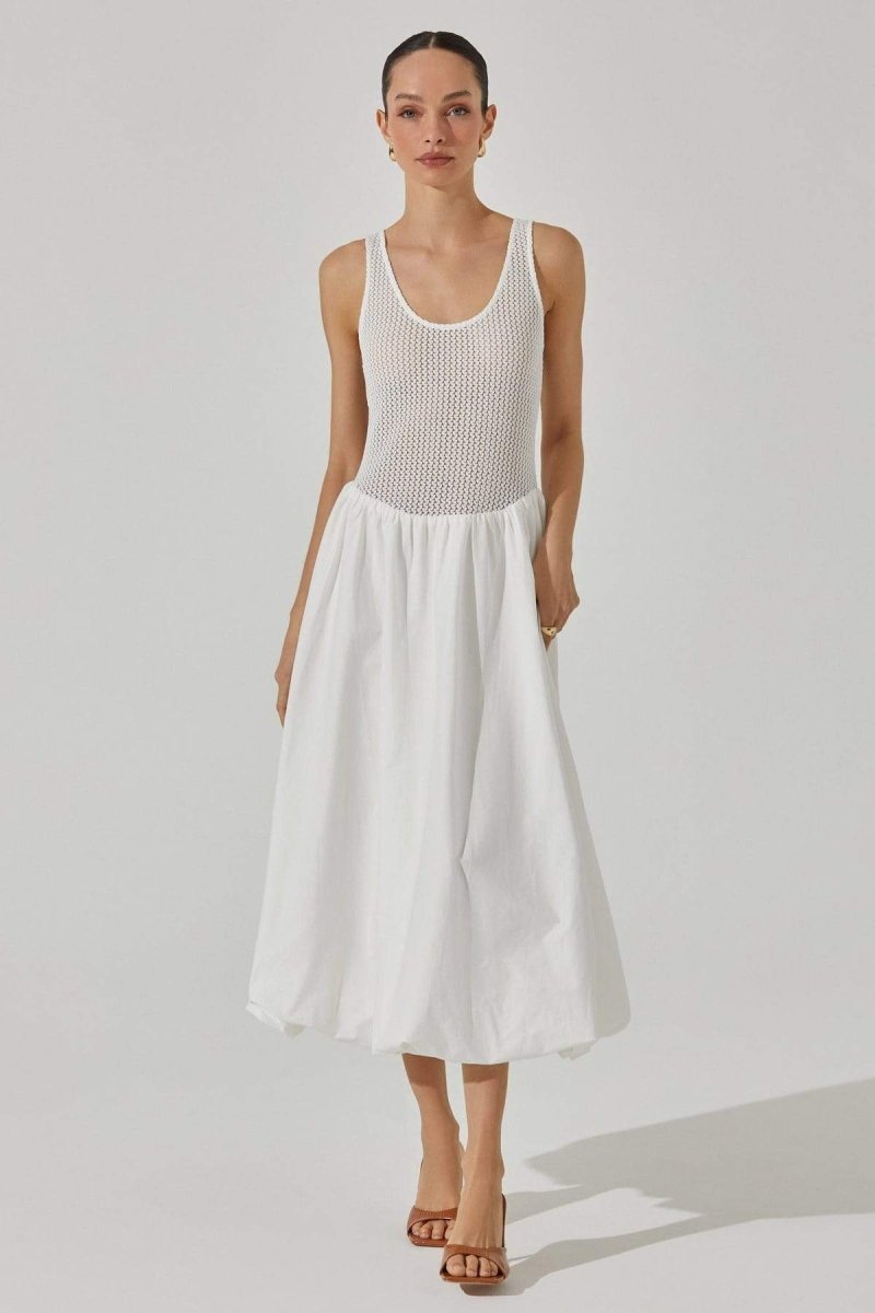 Woman in white crochet knit bodice dress