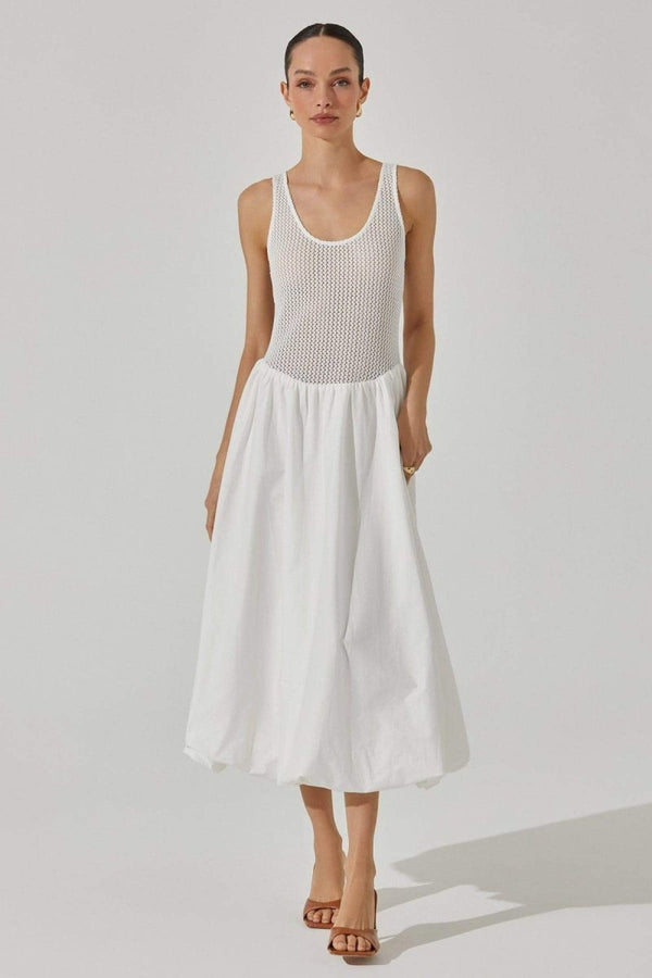Woman in white crochet knit bodice dress