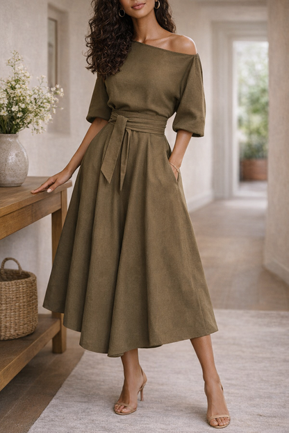 Dark Red - A woman wearing an olive green off-the-shoulder midi dress with a matching self-tie belt at the waist, styled with neutral heeled sandals and a black clutch.