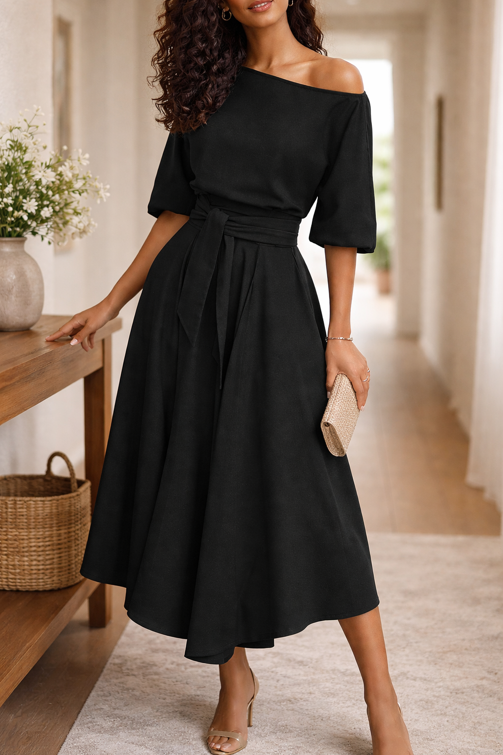 Black - A woman wearing an olive green off-the-shoulder midi dress with a matching self-tie belt at the waist, styled with neutral heeled sandals and a black clutch.