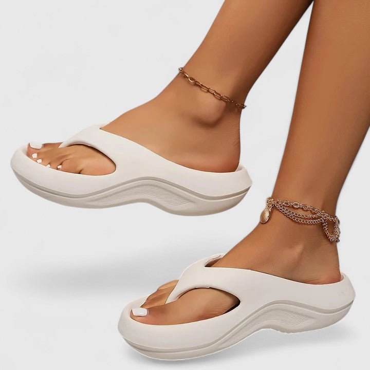 White - Molded EVA platform thong sandals featuring a thick shock-absorbing sole with a wavy contrast midsole and contoured footbed