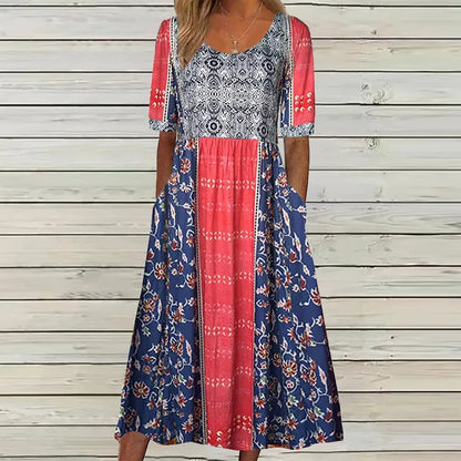 Multicolor3 - A woman wearing a bohemian-style maxi sundress featuring a multi-colored paisley and ditsy floral print, scoop neckline, half sleeves, and functional side pockets.
