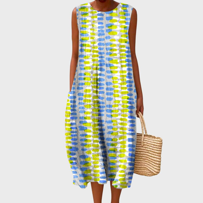 Light Gray - Woman wearing a sleeveless, plaid midi sundress with a pleated waist and side pockets, holding a woven straw bag.