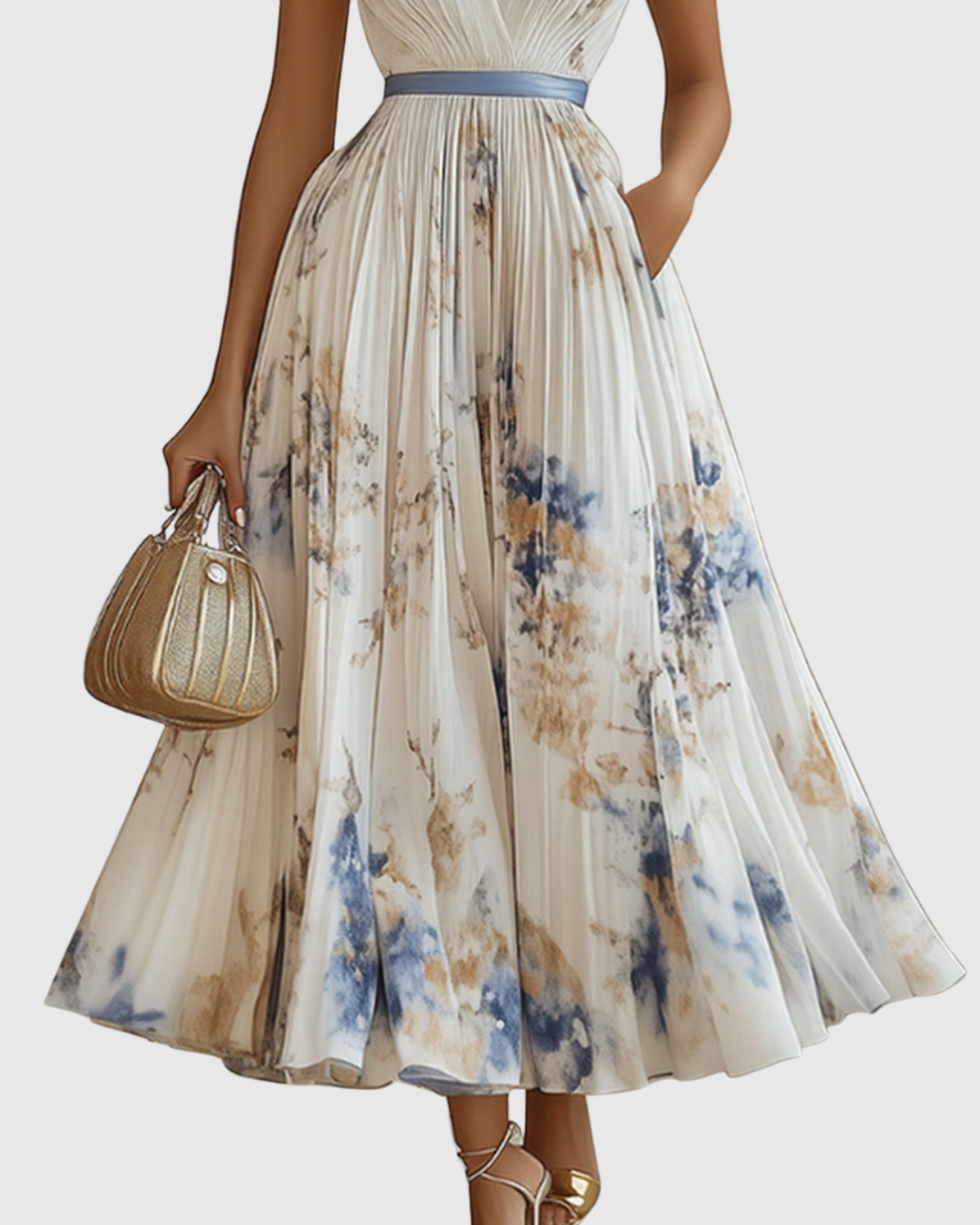 White - Model wearing a sleeveless, plunging V-neck midi dress in pleated off-white chiffon with a blue and gold watercolor floral print, featuring a cinched blue waist band and a flowy A-line skirt with pockets.