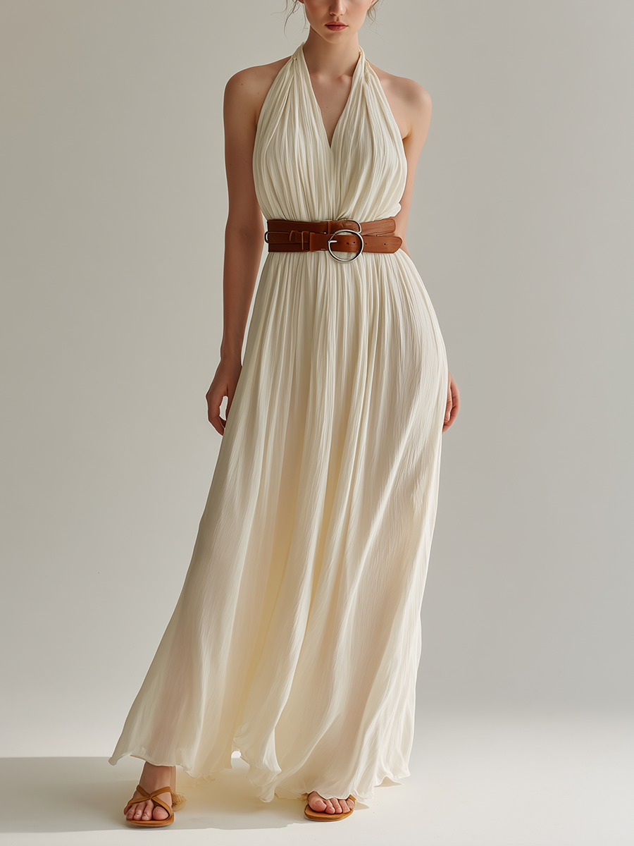 White - Sleeveless floor-length halter maxi dress in finely pleated fabric, styled with a double-wrap brown leather belt.