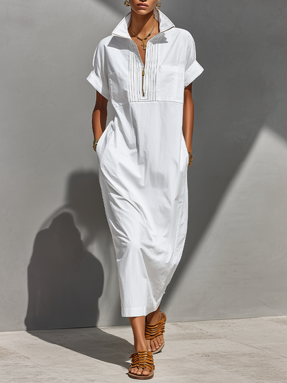 White - Model walking outdoors wearing a crisp, relaxed-fit maxi shirtdress with a stand collar, short sleeves, and front half-zipper detail.