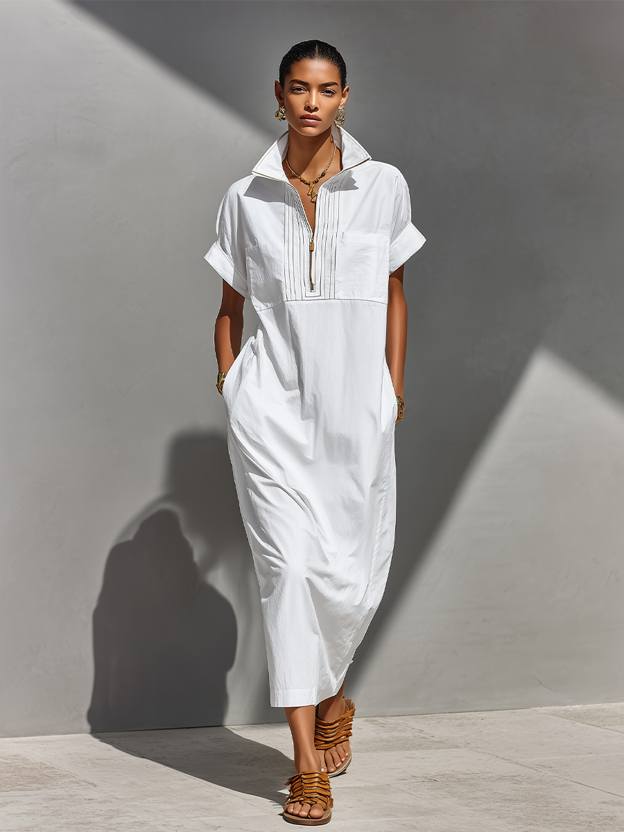 White - Model walking outdoors wearing a crisp, relaxed-fit maxi shirtdress with a stand collar, short sleeves, and front half-zipper detail.