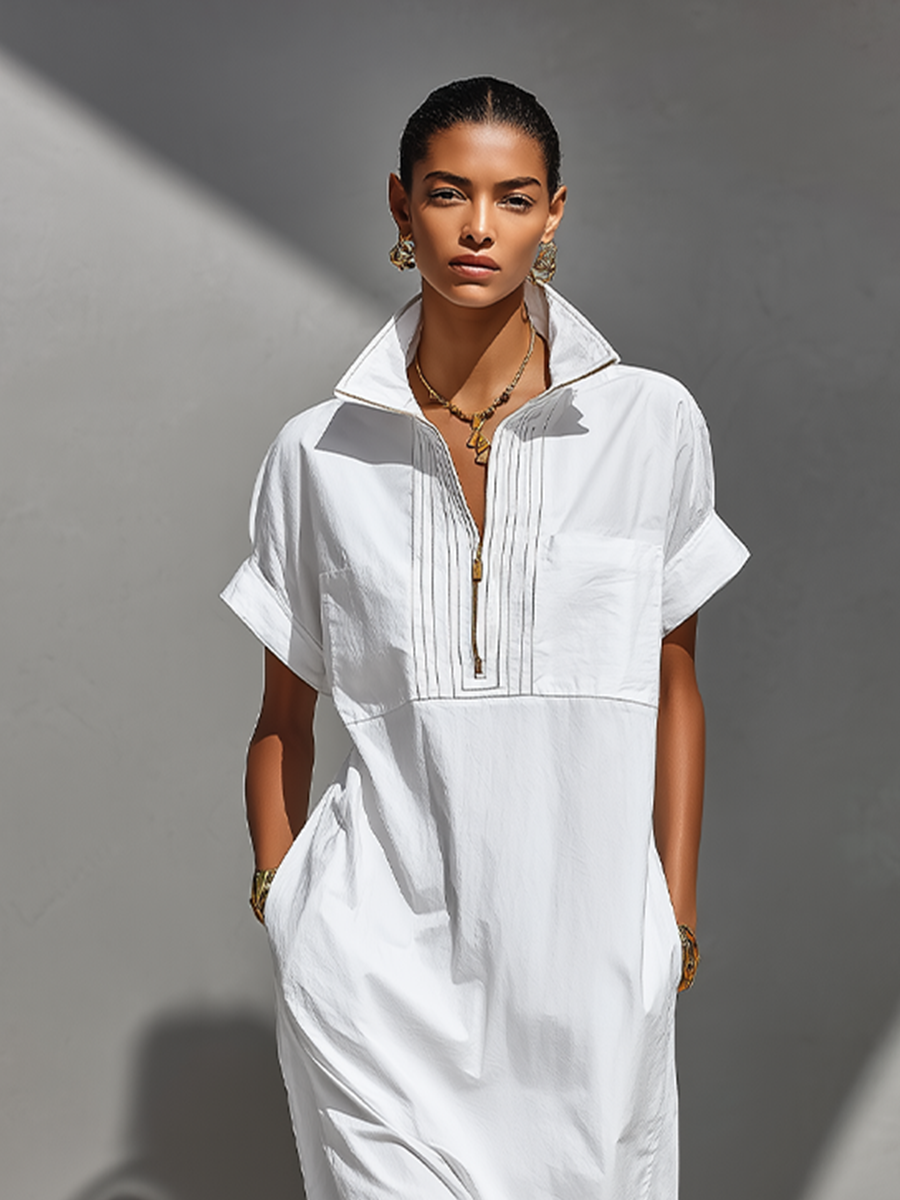 White - Model walking outdoors wearing a crisp, relaxed-fit maxi shirtdress with a stand collar, short sleeves, and front half-zipper detail.