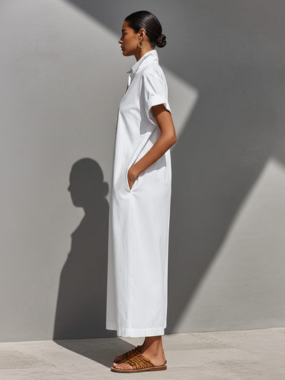 White - Model walking outdoors wearing a crisp, relaxed-fit maxi shirtdress with a stand collar, short sleeves, and front half-zipper detail.